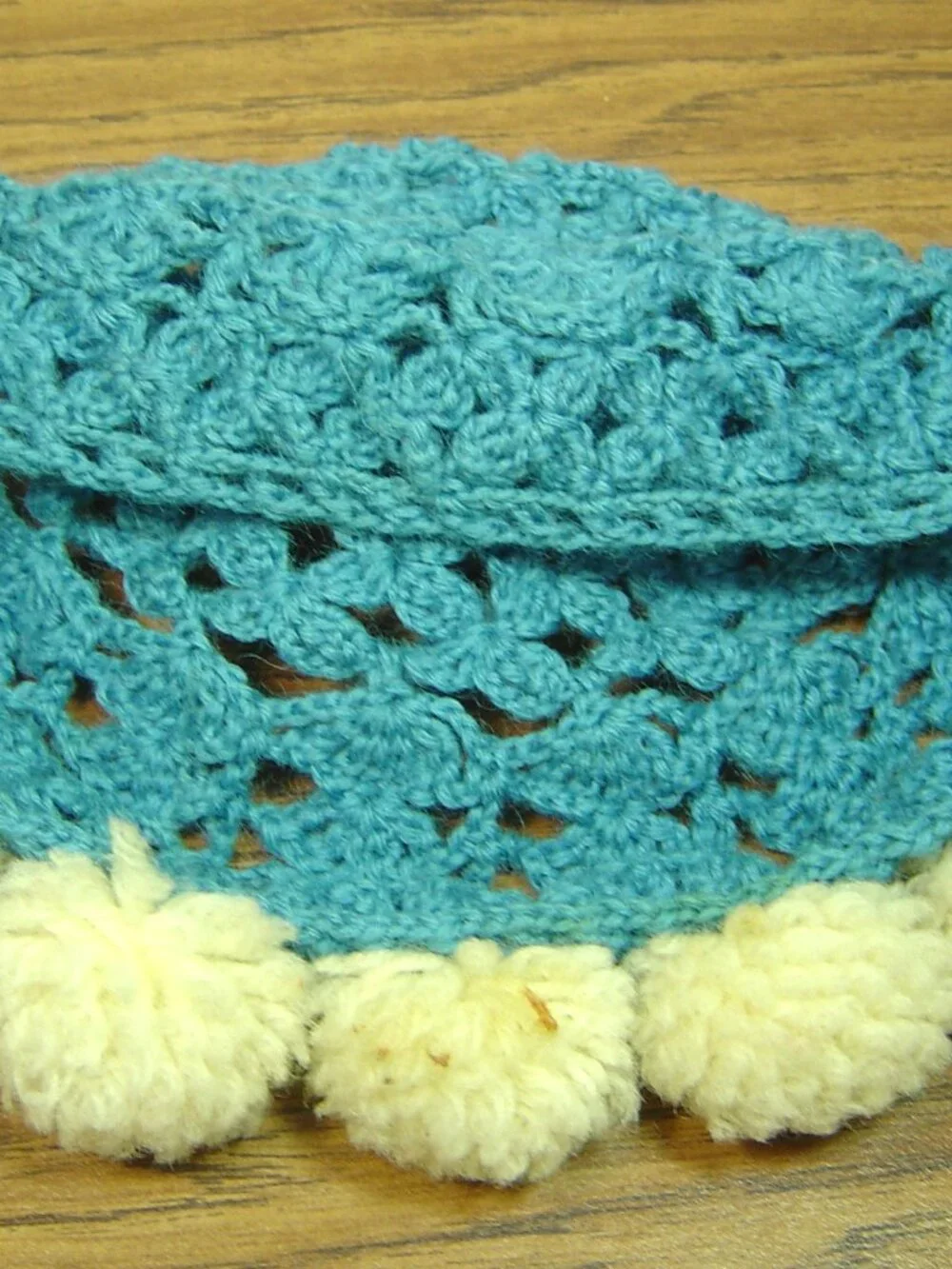 Vintage handmade blue crocheted baby/toddler hat/cap with pompom trim